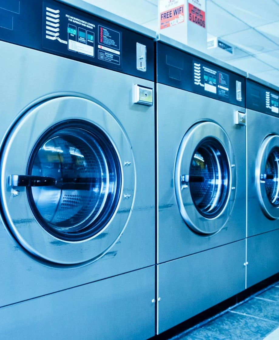 row of washers in laundromat