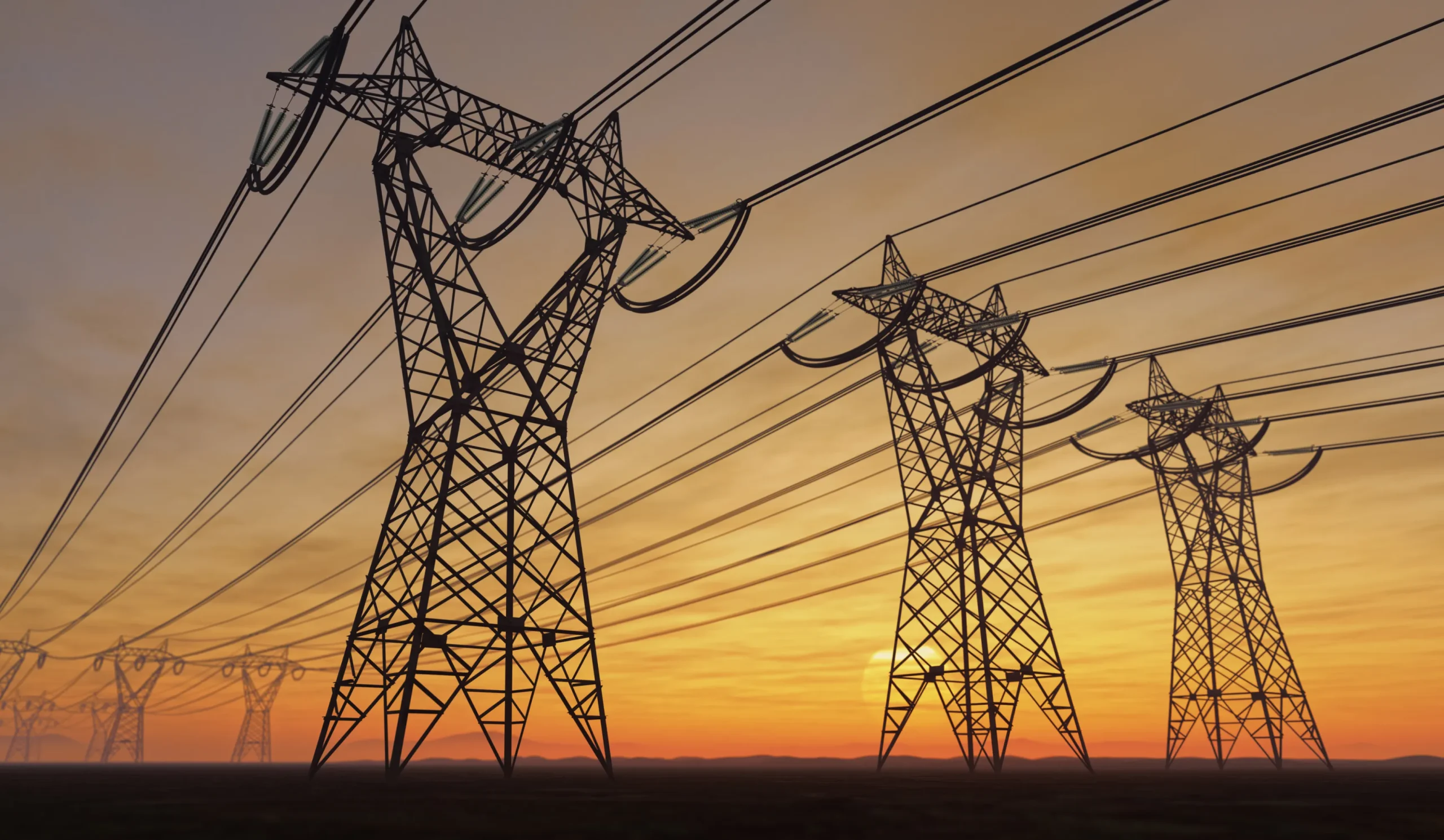 Silhouetted power lines and towers stretch across the horizon against a vibrant sunset sky, with hues of orange and yellow blending into darkening tones near the edges.